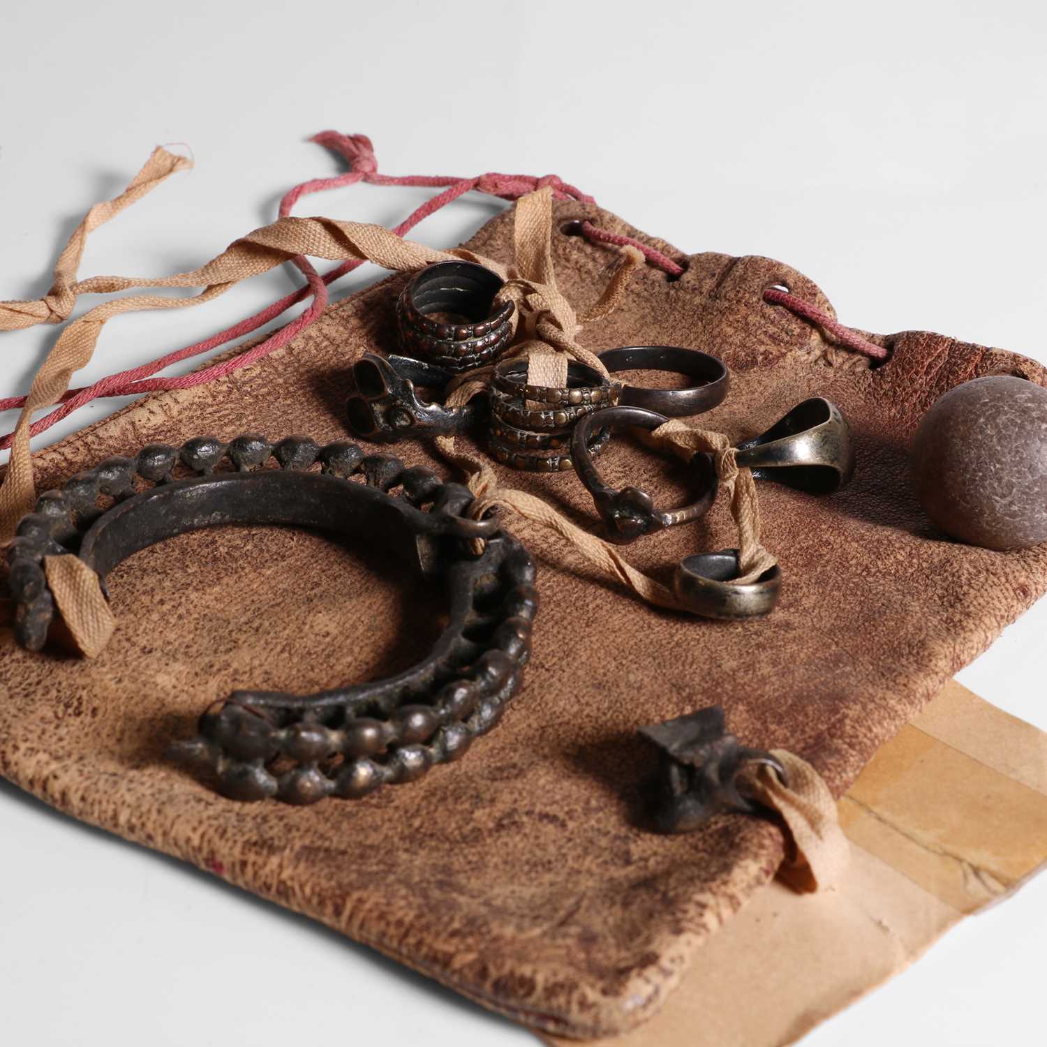 A group of objects found inside a Ganges crocodile (Sold for £930)